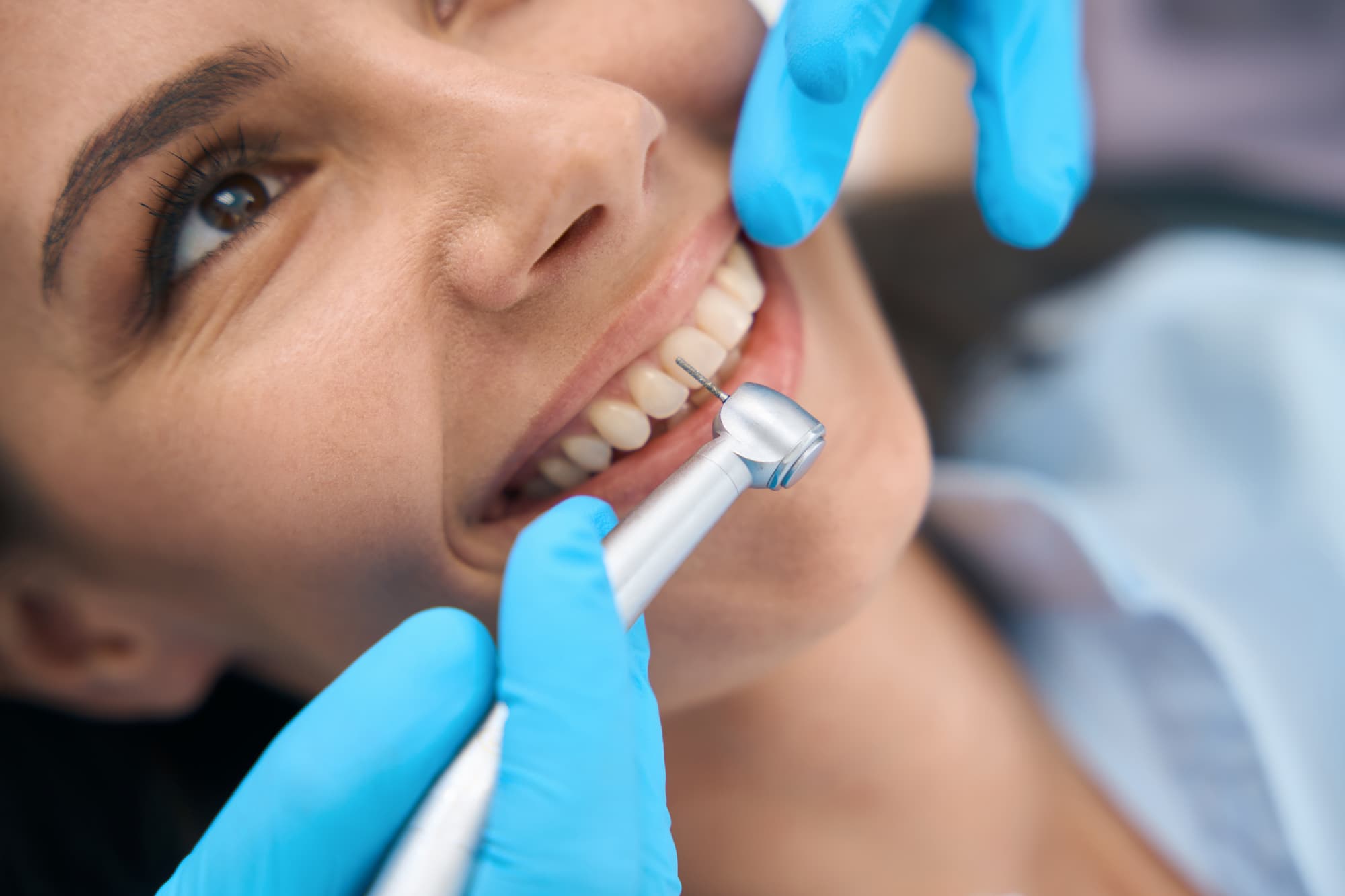 close-up-dentist-in-protective-gloves-using-dental-2023-11-27-05-36-28-utc.jpg